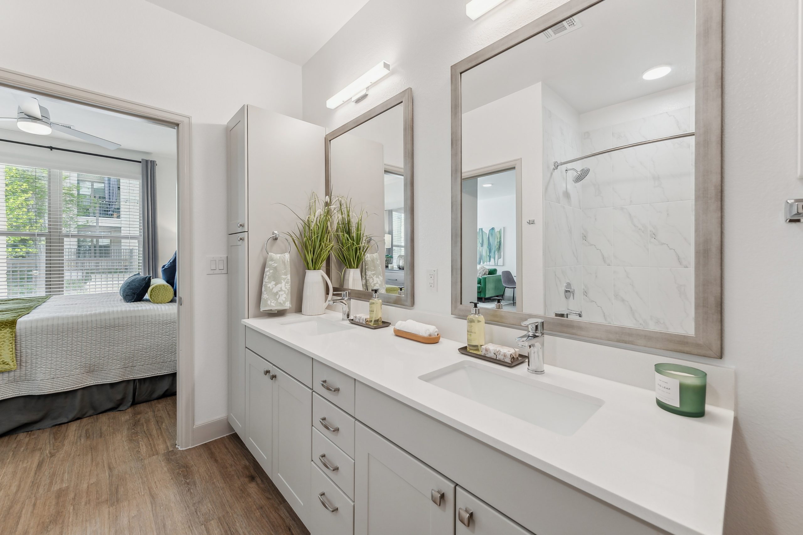 Modern bathroom with double vanity and marble finishes